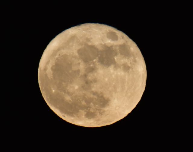 Different camera settings of the Super Moon on the night after the full moon.